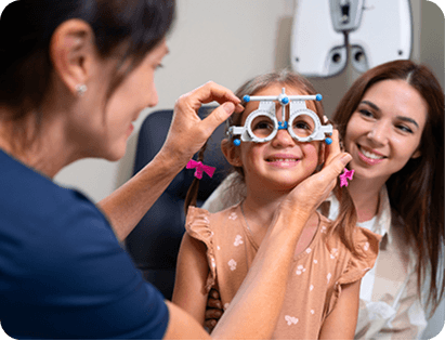 Young girl having modern eye test with specialized trial frame equipment
