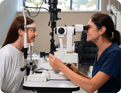 Compassionate eye specialist performing slit lamp examination in welcoming clinic